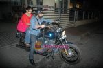 Arshad Warsi on his Harley bike with wife Maria as they went to watch The King_s Speech on 8th March 2011 (4).JPG